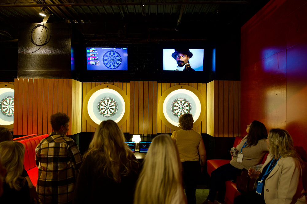 Snoop Dogg et al. standing in front of a crowd